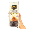 Hand holding a package of Siam Ramen Egg Noodles on a white background